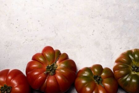 Tomatoes on a metal backgroundの写真素材