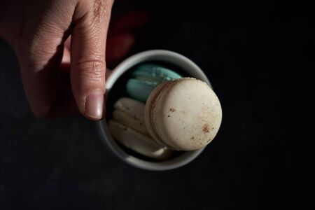 macarones in a coffee cupの写真素材