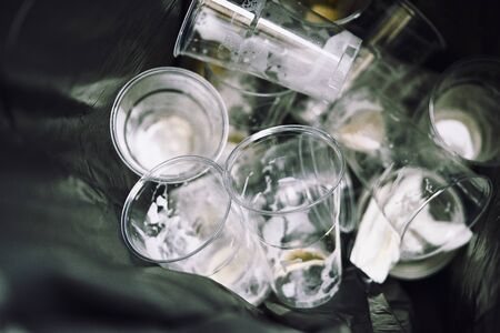 basket full of empty plastic beer glasses, upper viewの写真素材