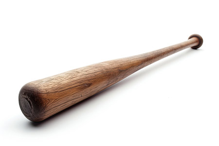 A wooden baseball bat on a white surface.の素材