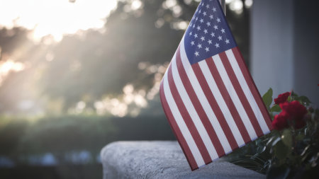 American Flag in Sunlight, Symbol of Patriotism and Freedom, Outdoor US Flag, Blurred Nature Background.の素材