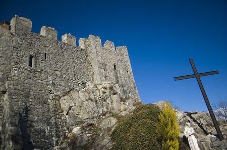 Part of the stone fortress with blue sky in the backgroundの写真素材