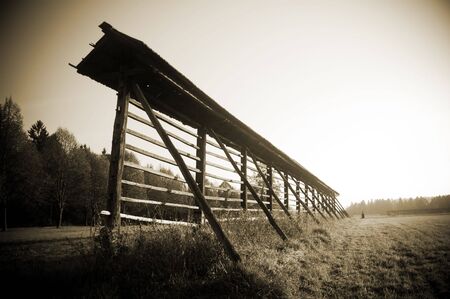 A sepia photo of a drying frame in Slovenian countrysideの写真素材