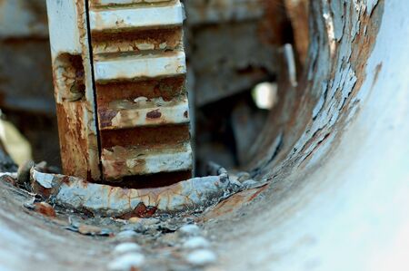 Rusty closeup of an old machinery with a gear detailの写真素材
