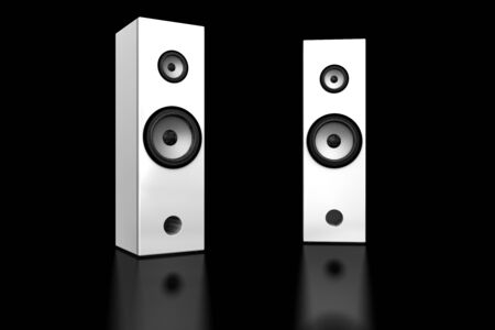 Two white speaker boxes on black backgroundの写真素材