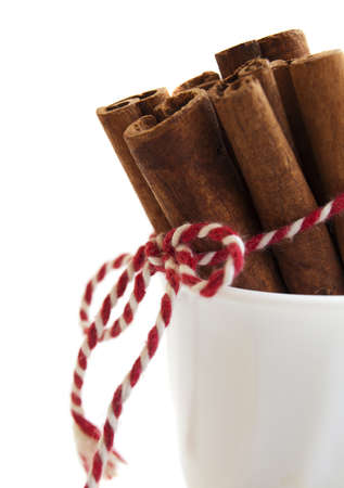 Cinnamon sticks bunch on a white backgroundの写真素材