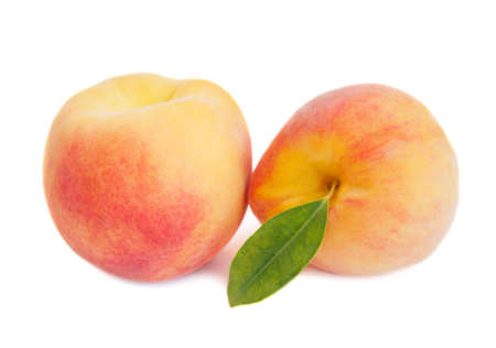 Tasty juicy peaches on a white backgroundの写真素材