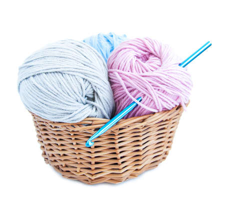 Basket with crochet hook and yarn on a white backgroundの写真素材