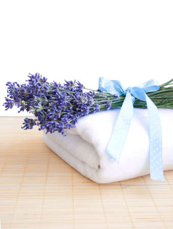 lavender bunch with blue ribbon  and white towel の写真素材