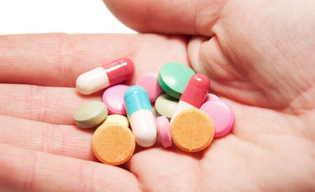 Pills in hand representing health, help and medicine conceptの写真素材