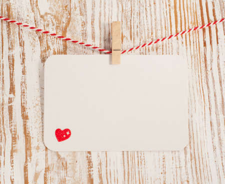 Card with  heart on wood, for your love messageの写真素材