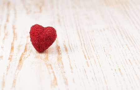 Red Heart on a old wooden background