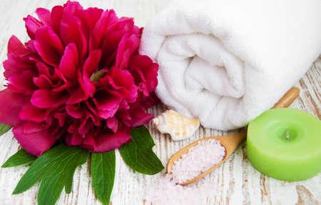 Spa tranquille still life with a towel, flower and sea saltの写真素材