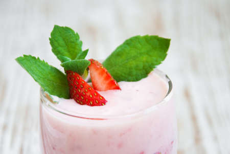Glass of strawberry yogurt, with fresh strawberriesの写真素材