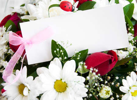 flowers with a white card for a messageの写真素材