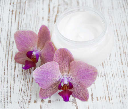 Wellness and spa scene with orchids and beauty cream