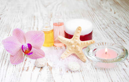 Spa setting with natural soaps, orchids flower and candleの写真素材