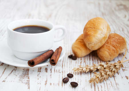 Croissant and a cup of delicous coffeeの写真素材