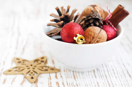 Still life of a bowl of Christmas ornamentsの写真素材