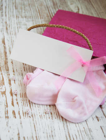 baby  pink apparel with blank greeting cardの写真素材