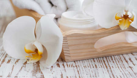 Spa setting with spa towel and white orchidsの写真素材