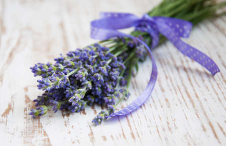 Bunch of lavender flowers  on  a wooden  backgroundの写真素材