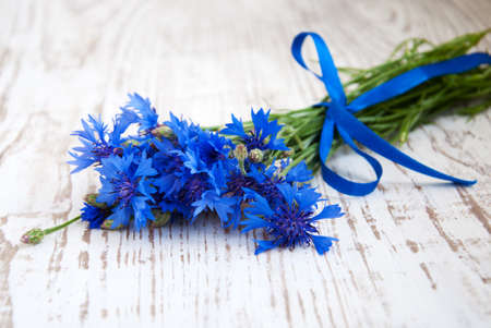 Cornflower bouquet  on a wooden  backgroundの写真素材