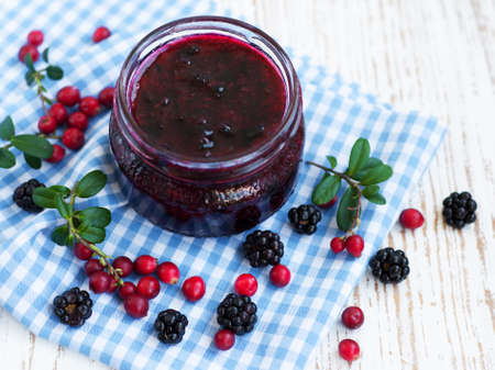 Jar of Homemade  jam on a wooden backgroundの写真素材