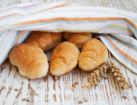 Fresh Croissant  on the old wooden backgroundの写真素材