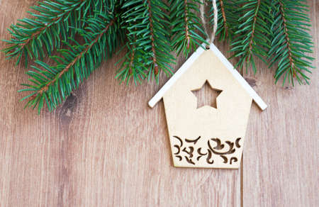 Christmas decoration - Christmas toy and evergreen branch on a wooden の写真素材