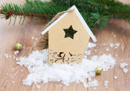 Christmas decoration - Christmas toy and evergreen branch on a wooden の写真素材