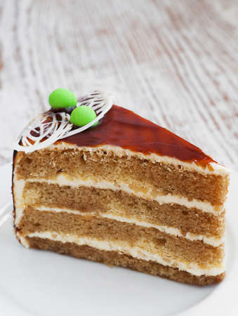 Piece of cake on a wooden backgroundの写真素材