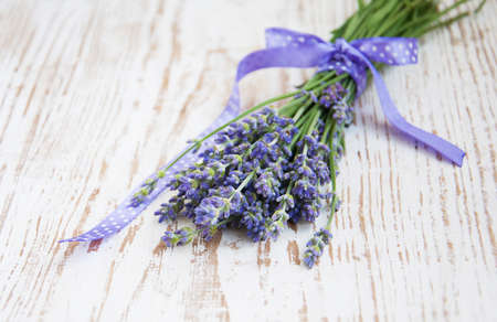 Bunch of lavender flowers  on  a wooden  の写真素材