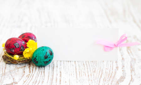 Easter card and eggs on a wooden background