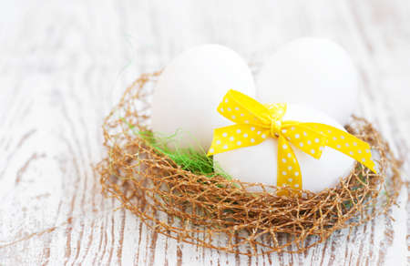 Nest with eggs on a wooden の写真素材