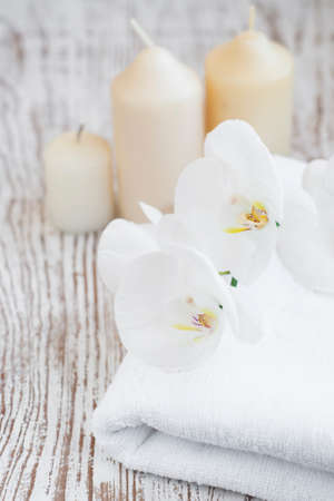 Orchids and towel on a old wooden backgroundの写真素材
