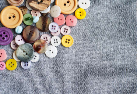 Mixed  Sewing Buttons on a knitting  background