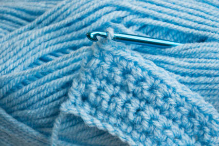 Crochet hook and knitting yarn - closeup