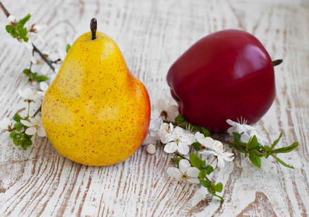 apple,  pear and spring blossom on a wooden backgroundの写真素材