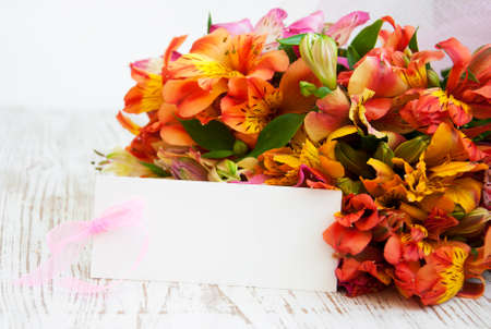  alstroemeria flowers with a white card for a message.の写真素材