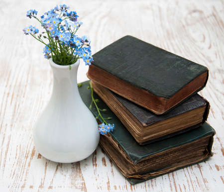 Three very Old Book on a wooden backgroundの写真素材