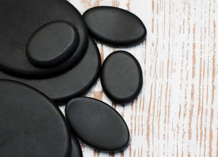 Spa stones on a old wooden  backgroundの写真素材