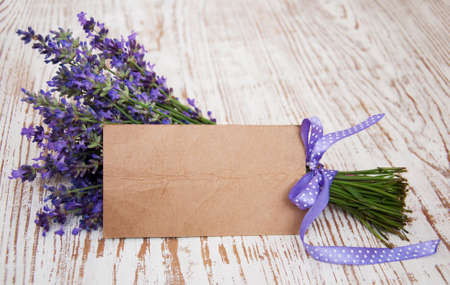 Lavender on vintage wood with old blank tagの写真素材