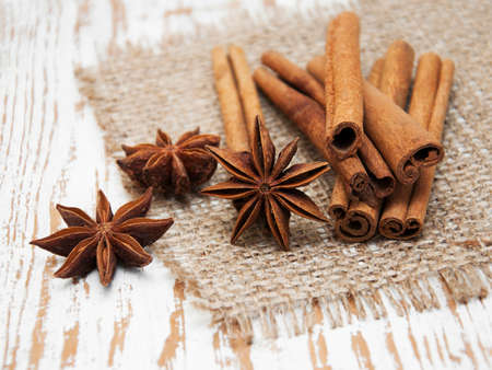 Star anis and cinnamon stick on a wooden backgroundの写真素材