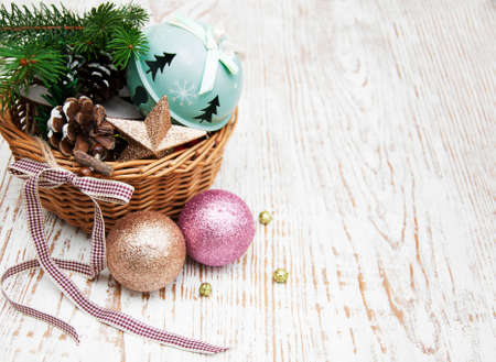 Christmas basket with toys on a wooden  backgroundの写真素材