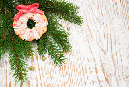 Christmas tree border - branch of evergreen tree with cookie toyの写真素材