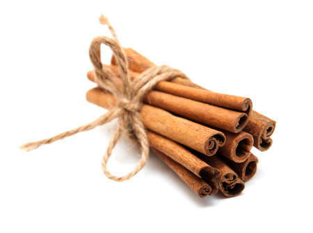 Cinnamon sticks bunch on a white  backgroundの写真素材