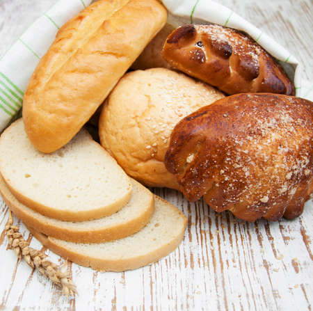 Bread and wheat on a wooden backgroundの写真素材