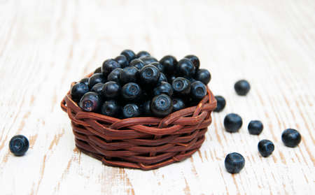 fresh ripe blueberries  on a wooden backgroundの写真素材