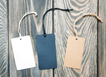 Canvas empty price tags on a  old wooden backgroundの写真素材